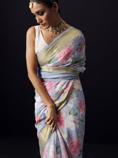 Greyish blue floral saree with golden zari border