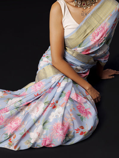 Greyish blue floral saree with golden zari border