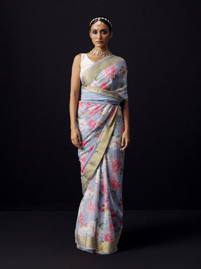 Greyish blue floral saree with golden zari border